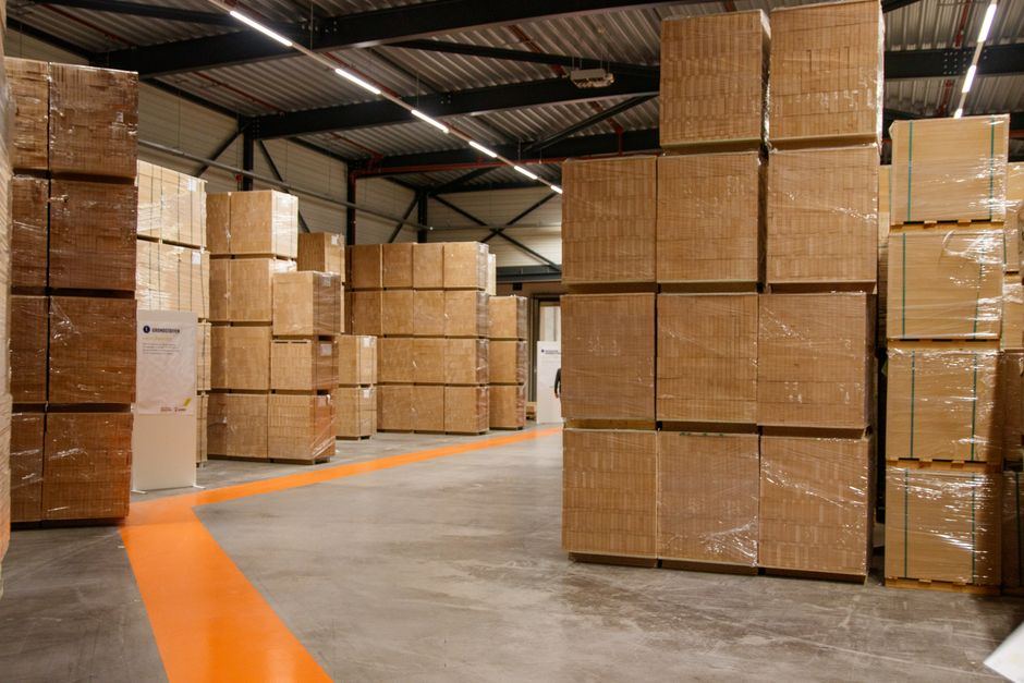 Wrapped cartons stacked in a warehouse